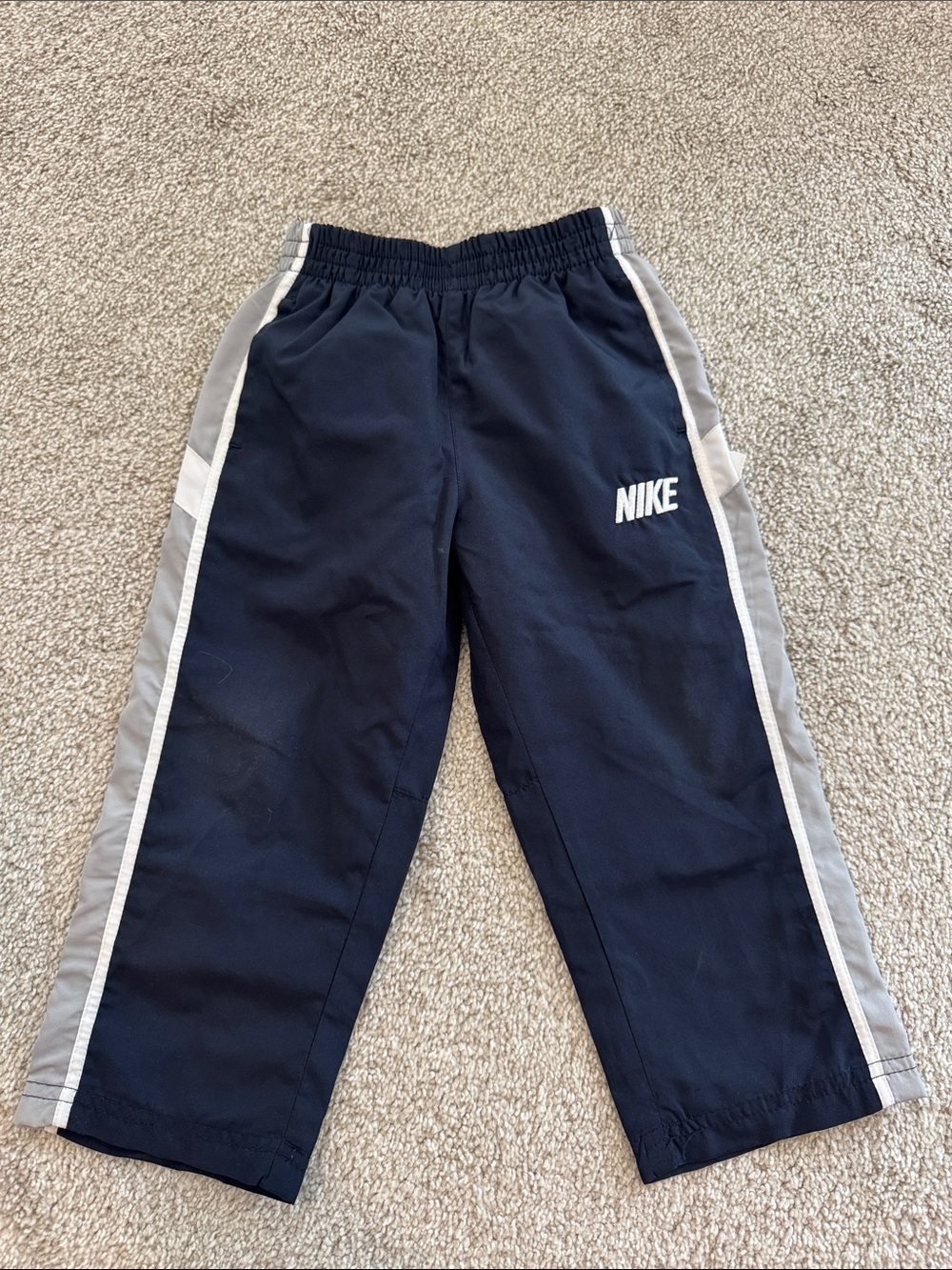 Nike Kids Navy Track Pants with Gray Side Stripes